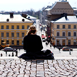 Person sitting on a wall in Finland